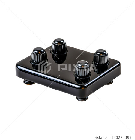 Black electronic device on a white background with knobs and polished finish 130273393