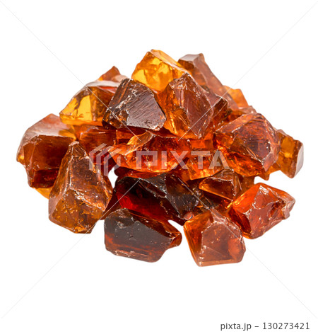 Amber Gemstones in Various Shapes and Sizes Piled Together on a White Background 130273421