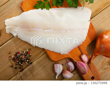 Raw halibut fillet on wooden table Raw halibut fillet on wooden table 130273999