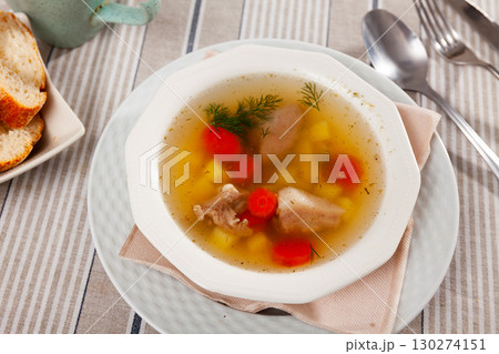 Rustic style soup in meat stock with pork and vegetables Rustic style soup in meat stock with pork and vegetables 130274151