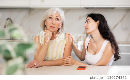 Young woman apologizes to elderly woman after quarrel 130274551