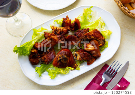 Grilled pork spare meal with garnish of french fries and leaf salad Grilled pork spare meal with garnish of french fries and leaf salad 130274558