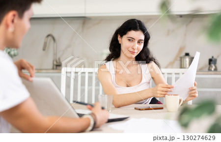 Guy manager tells girl client about specifics of design of microloan, about benefits and advantages Guy manager tells girl client about specifics of design of microloan, about benefits and advantages 130274629