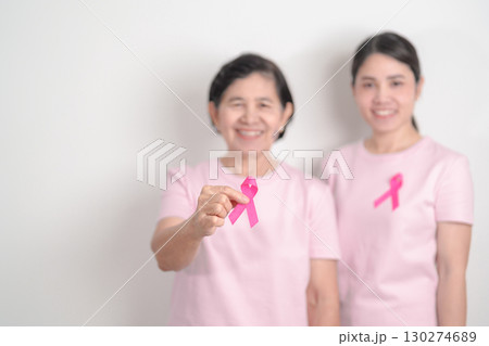 Couple woman with pink Ribbon for Pink October Breast Cancer Awareness month, May Women Health, November Birth Parents Adoption, women rights, Empowerment, March International Women day and Cancer day 130274689