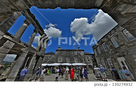 Sunny Day Market Scene in a Historic Stone Courtyard 130274932