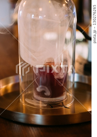 Cold smoke liquor. Alcoholic beverage. Fragrant drink served on metal bar tray. Professional equipment for cocktail technique preparation. Cold smoke liquor. Alcoholic beverage. Fragrant drink served on metal bar tray. Professional equipment for cocktail technique preparation. 130276265