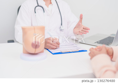 woman Patient consultation with doctor for Breast Augmentation Surgery, October Breast Cancer Awareness month, implant, Diagnosis, Beauty woman enlargement and medical healthcare concept woman Patient consultation with doctor for Breast Augmentation Surgery, October Breast Cancer Awareness month, implant, Diagnosis, Beauty woman enlargement and medical healthcare concept 130276480