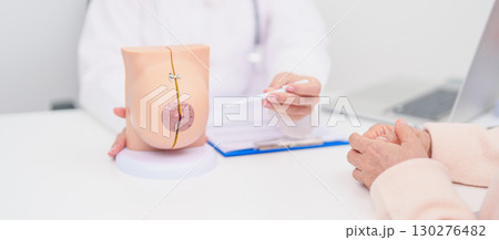 woman Patient consultation with doctor for Breast Augmentation Surgery, October Breast Cancer Awareness month, implant, Diagnosis, Beauty woman enlargement and medical healthcare concept 130276482