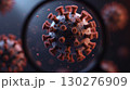 Magnified 3D view of a virus with red spike proteins 130276909