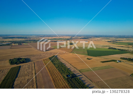 Aerial landscape of farmland with agricultural fields under clear sky Aerial landscape of farmland with agricultural fields under clear sky 130278328