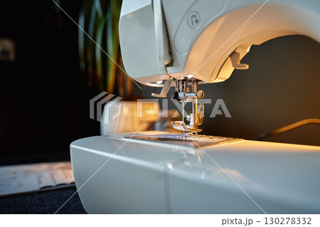 Close-up of sewing machine needle and presser foot Close-up of sewing machine needle and presser foot 130278332
