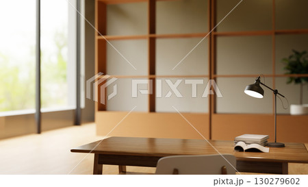 Minimalist workspace with wooden desk, desk lamp, stacked books, and open notebook in modern office 130279602