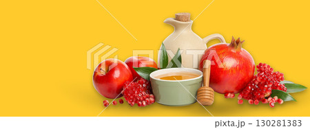 Apples and pomegranates with honey in a bowl on a bright background 130281383