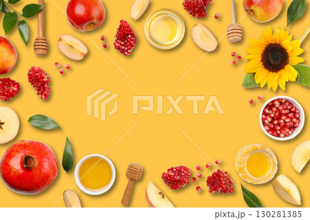 Fruits and honey on vibrant yellow evoke fall vibes 130281385