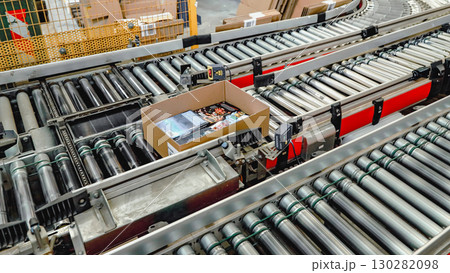 logistic warehouse. packing line in a logistics warehouse. conveyor belt in a modern production line 130282098