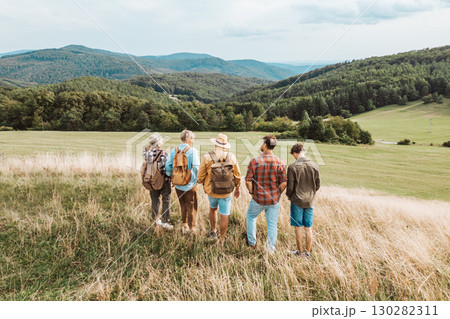 Aerial view of multigenerational family on hiking trip in nature. 130282311