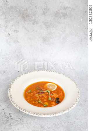 Traditional Georgian bean soup Lobio with herbs in ceramic plate 130282803