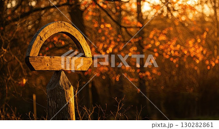 Ancient wooden symbol glows in sunset light. An ancient, sacred pagan site Ancient wooden symbol glows in sunset light. An ancient, sacred pagan site 130282861