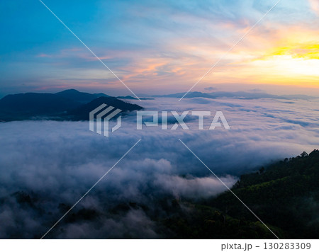Amazing Sunrise over mountains hills covered with mist, Aerial view landscape drone shot beautiful sky colorful light nature background Amazing Sunrise over mountains hills covered with mist, Aerial view landscape drone shot beautiful sky colorful light nature background 130283309