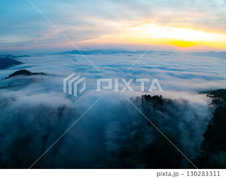 Amazing Sunrise over mountains hills covered with mist, Aerial view landscape drone shot beautiful sky colorful light nature background Amazing Sunrise over mountains hills covered with mist, Aerial view landscape drone shot beautiful sky colorful light nature background 130283311