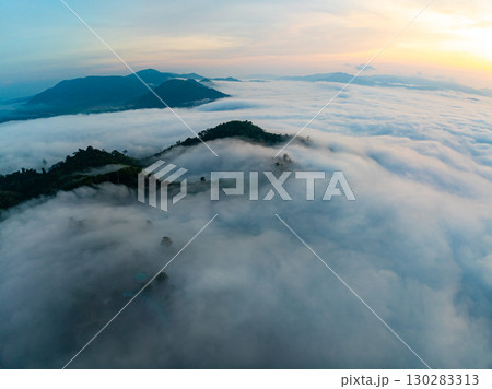 Amazing Sunrise over mountains hills covered with mist, Aerial view landscape drone shot beautiful sky colorful light nature background 130283313