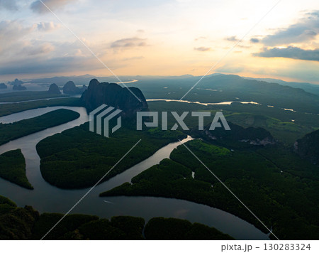Mangrove forest and river landscape at Phang Nga Thailand, Beautiful mangrove forest trees green background, High angle view trees background Mangrove forest and river landscape at Phang Nga Thailand, Beautiful mangrove forest trees green background, High angle view trees background 130283324