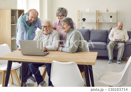 Group of elderly people use laptop to watch movies, read news and make video calls to relatives. Group of elderly people use laptop to watch movies, read news and make video calls to relatives. 130283714