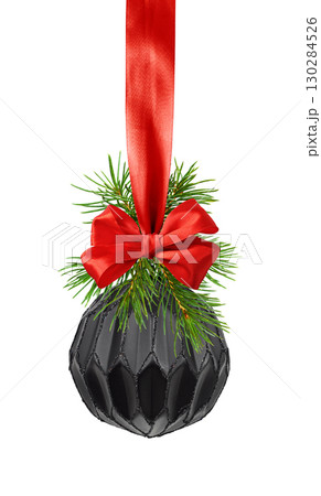 Black Christmas ball and green coniferous twigs hanging on red satin ribbon bow isolated Black Christmas ball and green coniferous twigs hanging on red satin ribbon bow isolated 130284526