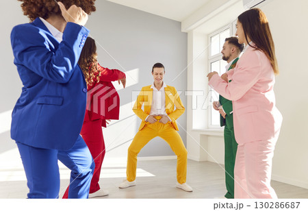 Funny dancing happy people wearing bright vivid color suit dancing, funny disco, rock and roll lover 130286687