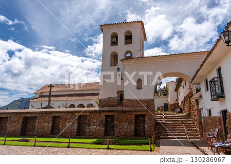 Colonial church in Chinchero, Peru, with white adobe bell tower 130286967