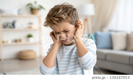 Young Boy Experiencing Ear Pain at Home 130287053