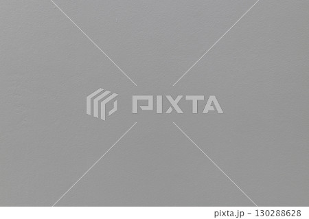 Smooth material texture of simple gray wall inside house creates neutral background. solid color surface provides calm and minimalist mood for any project 130288628