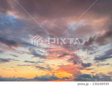 Fantastic sky. Bright landscape with sky, sun and gold, red and dark clouds 130289595