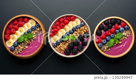 mix of different colors of berries and fruits in bowl 130289947