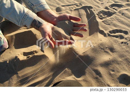 Dry sand in the hands of man. Drought and crop failure Dry sand in the hands of man. Drought and crop failure 130290033