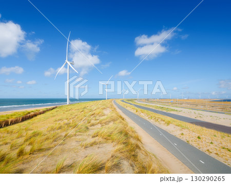 Green energy. Wind turbine on the seashore. Renewable and natural energy sources. Green energy. Wind turbine on the seashore. Renewable and natural energy sources. 130290265