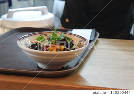 Salad in a plate with onions and olives side view Salad in a plate with onions and olives side view 130290444