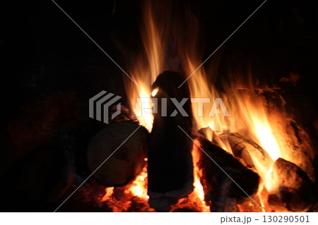 bonfire fire with smoke close-up in the dark on a black background. Burning wood, wood bonfire fire with smoke close-up in the dark on a black background. Burning wood, wood 130290501
