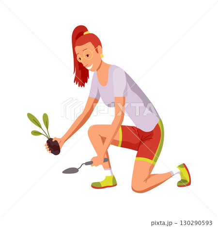 A woman kneels with a potted plant and shovel, working 130290593
