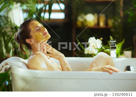 Peaceful Bathtub Retreat with Yellow Mask 130290811