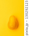 Yellow tomato with water drops on yellow background, macro food concept 130292123