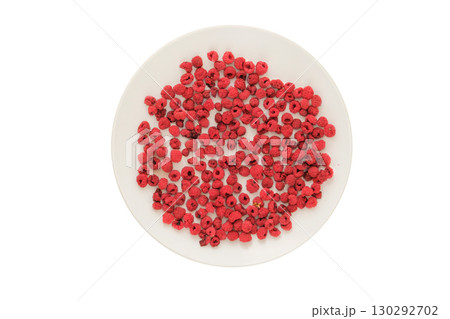 Top view. Lightweight food. Ingredient for preparing a freeze-dried breakfast. Dried raspberries on a white plate isolated on a white background. Top view. Lightweight food. Ingredient for preparing a freeze-dried breakfast. Dried raspberries on a white plate isolated on a white background. 130292702