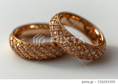 Pair of Wedding Rings on a white background. 130293309