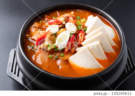 Korean food (Kimchi Jjigae), Kimchi soup with tofu and pork in Korean stone bowl 130293611