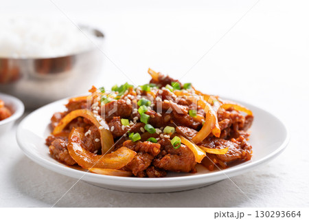 Korean stir fried spicy pork (Bulgogi) with cooked rice and kimchi on white background Korean stir fried spicy pork (Bulgogi) with cooked rice and kimchi on white background 130293664