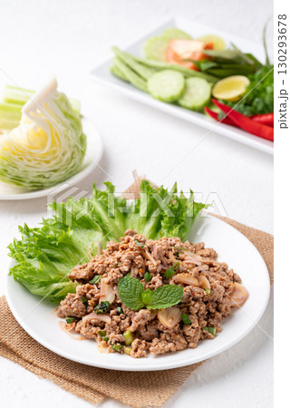 Local Thai food, Spicy minced pork salad (Larb Moo) eating with fresh vegetables on white background Local Thai food, Spicy minced pork salad (Larb Moo) eating with fresh vegetables on white background 130293678