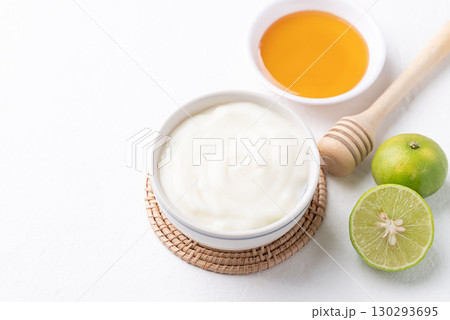 Yogurt, lime and honey on white background 130293695