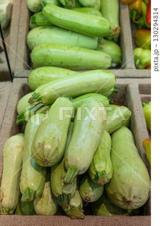 Green zucchini on the counter in a vegetable store 130294814
