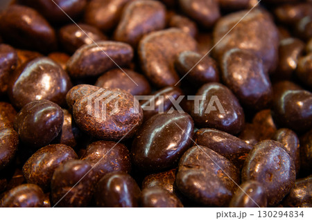 Nut balls covered with brown chocolate. Walnuts in chocolate glaze. Many top view 130294834