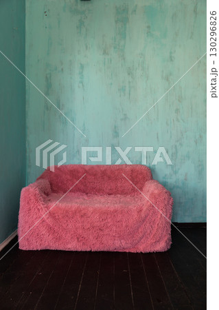 sofa in the interior of an empty blue room sofa in the interior of an empty blue room 130296826